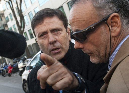 Dr Eufemiano Fuentes (L) arrives at the court house in Madrid on January 28, 2013